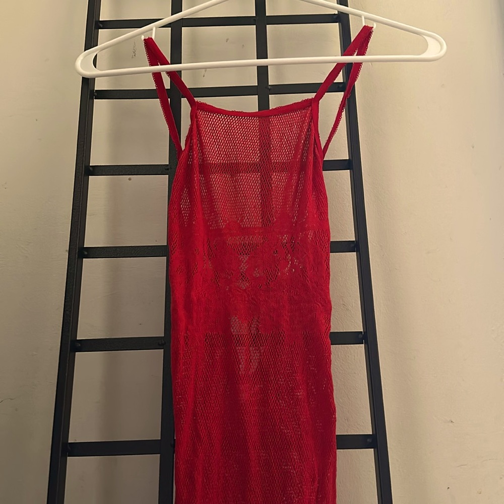 The Dreamgirl Red teddy is mesh with flowers across the chest that ties behind u